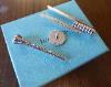 A Tiffany & Co Sterling Silver Golf Tee, Marker & Divot Tool Set