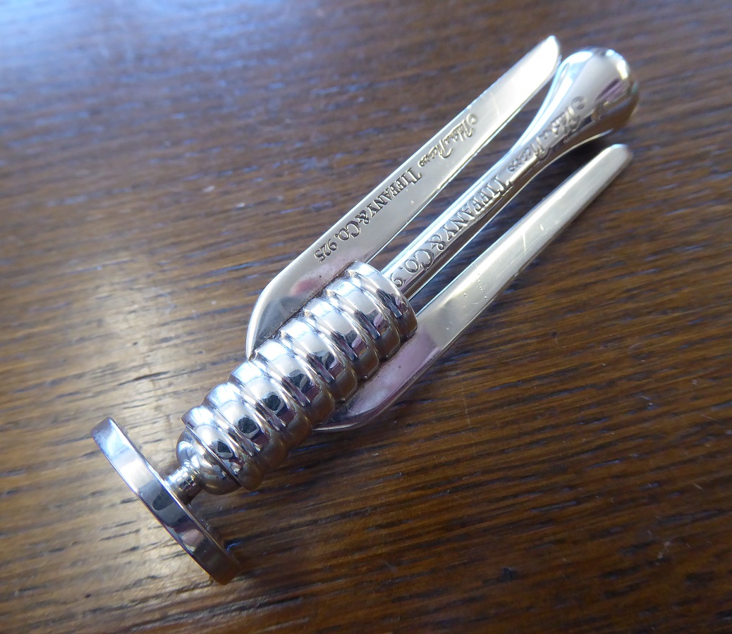 A Tiffany & Co Sterling Silver Golf Tee, Marker & Divot Tool Set