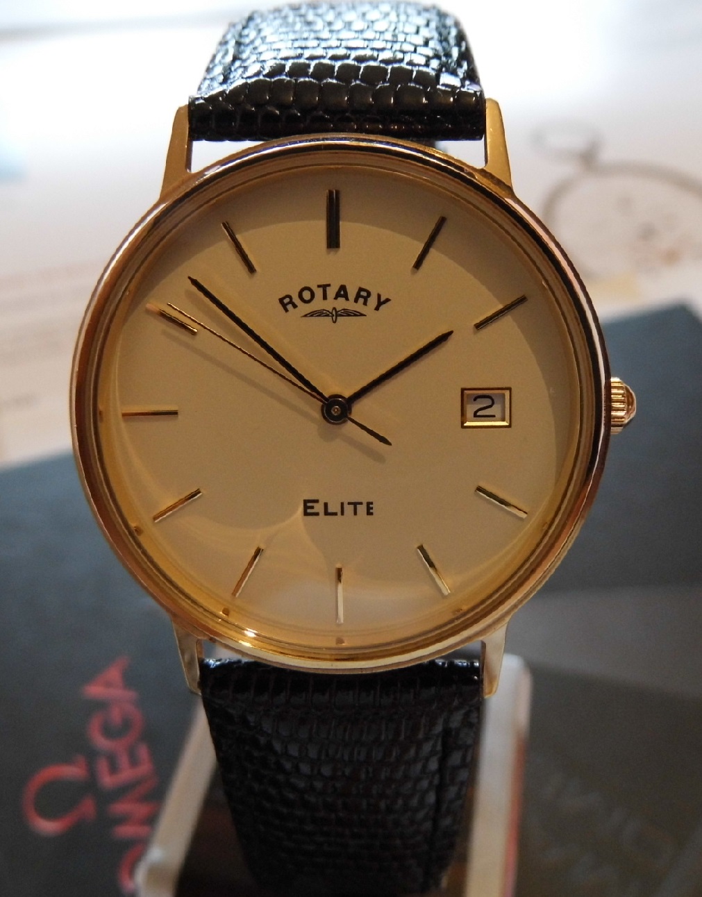 Rotary Elite 9K Gold, White Dial, Black Leather Strap