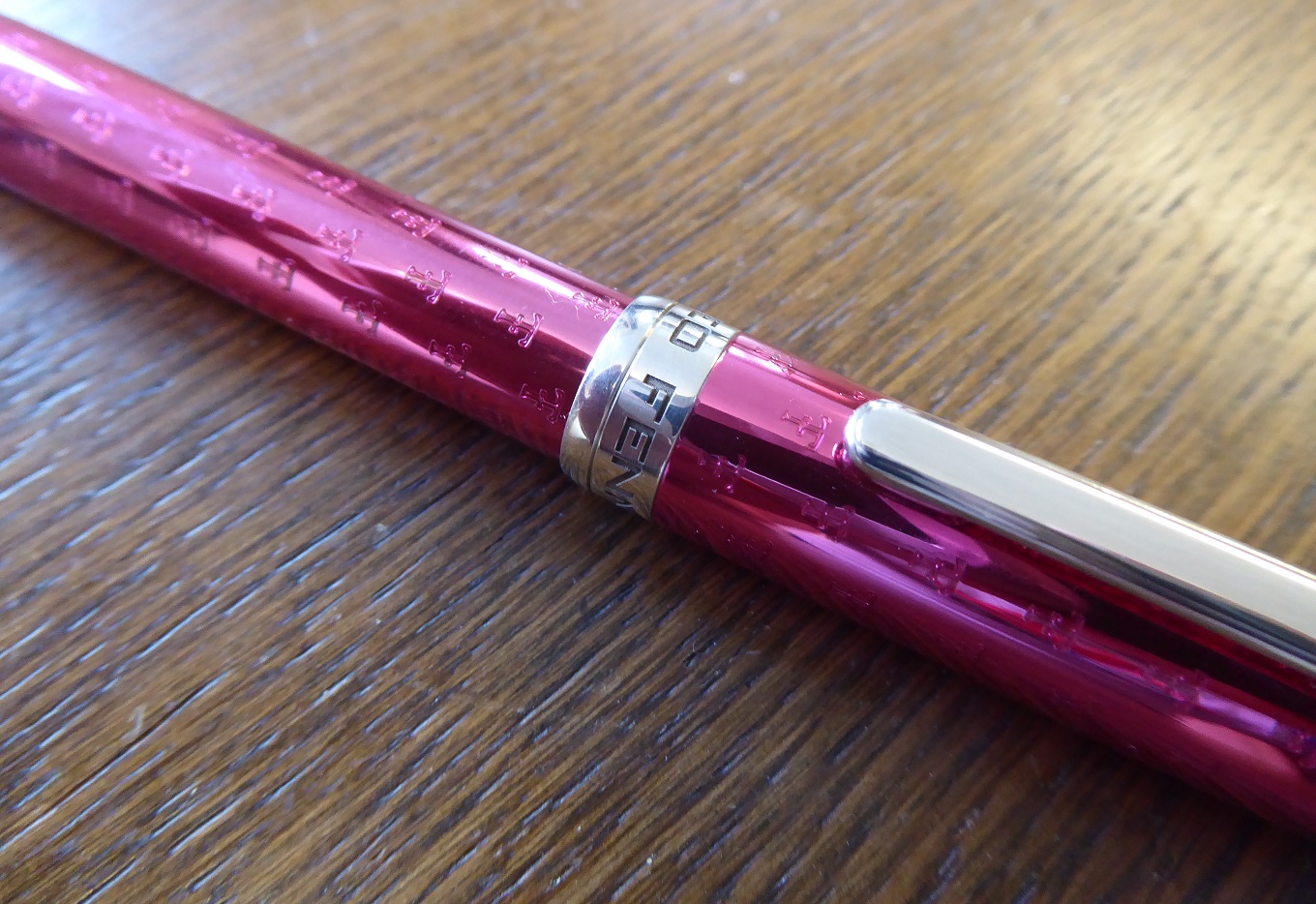 A Theo Fennell Pink Enamel & Silver Pen