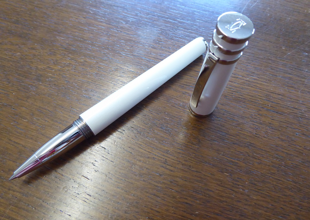 A Cartier Trinity De Cartier White Lacquer Rollerball Pen