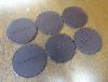 A Set Of Six Baume & Mercier Leather Coasters