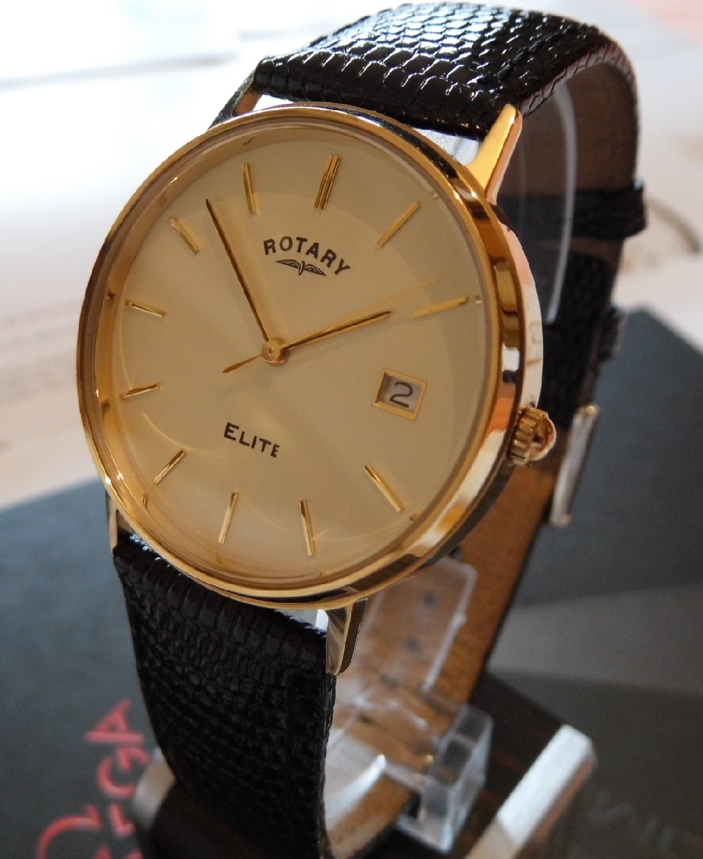 Rotary Elite 9K Gold, White Dial, Black Leather Strap