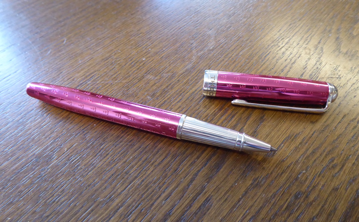 A Theo Fennell Pink Enamel & Silver Pen