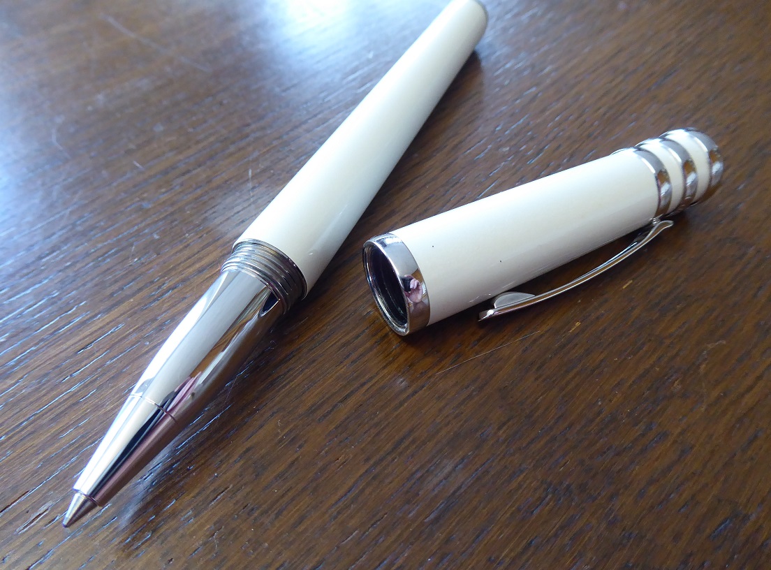 A Cartier Trinity De Cartier White Lacquer Rollerball Pen