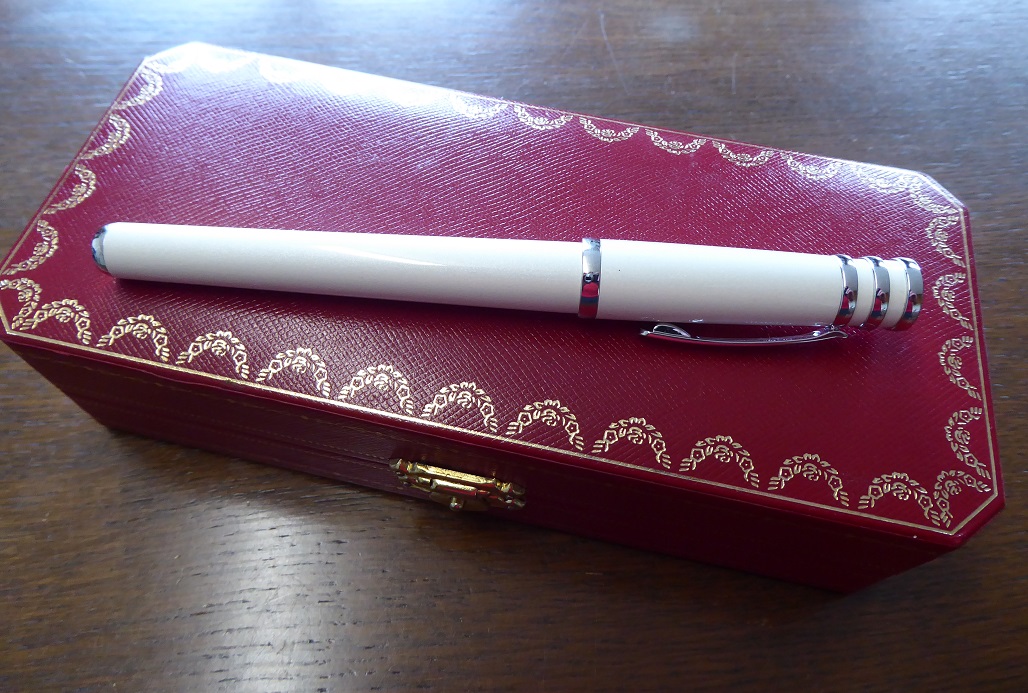 A Cartier Trinity De Cartier White Lacquer Rollerball Pen