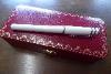 A Cartier Trinity De Cartier White Lacquer Rollerball Pen