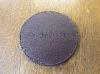A Set Of Six Baume & Mercier Leather Coasters