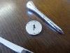 A Tiffany & Co Sterling Silver Golf Tee, Marker & Divot Tool Set